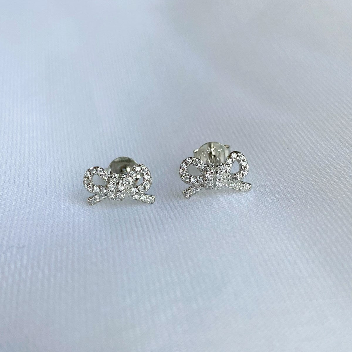 Sterling Silver Micropave Bowknot Stud Earrings - HK Jewels
