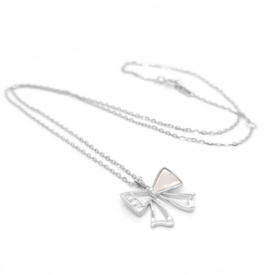 Rhodium Plated Sterling Silver Mother of Pearl and CZ Baguette Bowknot Pendant - HK Jewels